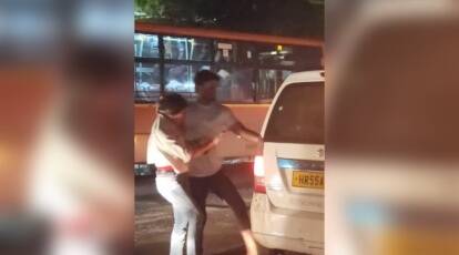 Delhi man thrashes woman, forcibly pushes her into cab on busy road; Probe on the viral video
