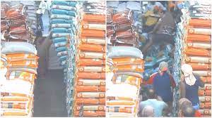 In CCTV footage: Woman gets trapped after pile of grain sacks fall on her; Swiftly rescued