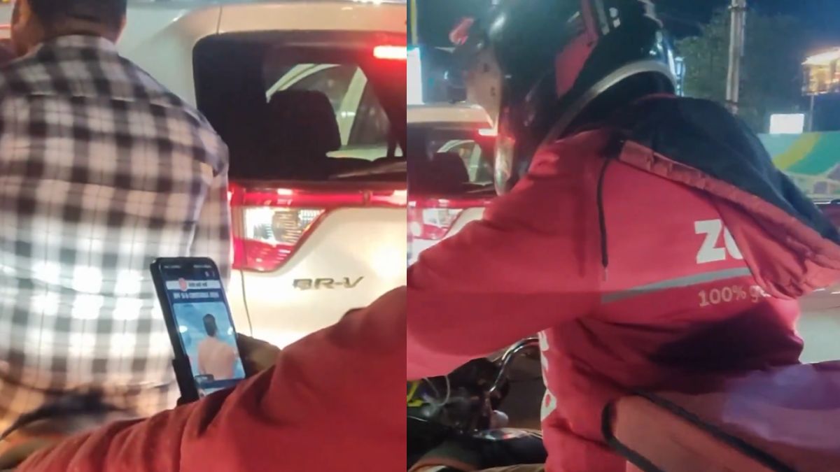 Video of Zomato boy studying for UPSC exam in the middle of traffic goes viral; Internet splits