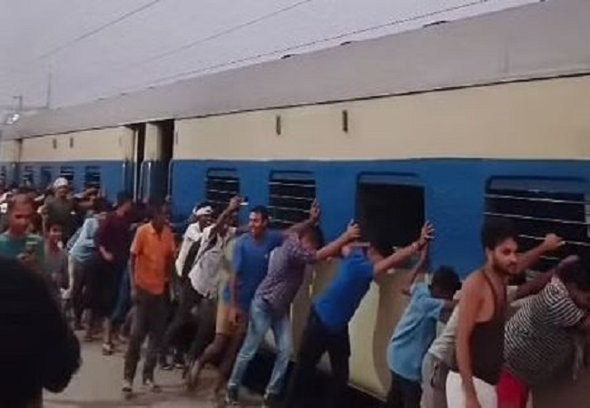Bihar viral video: Hundreds of passengers push express train to separate burning bogies at Kiul Junction